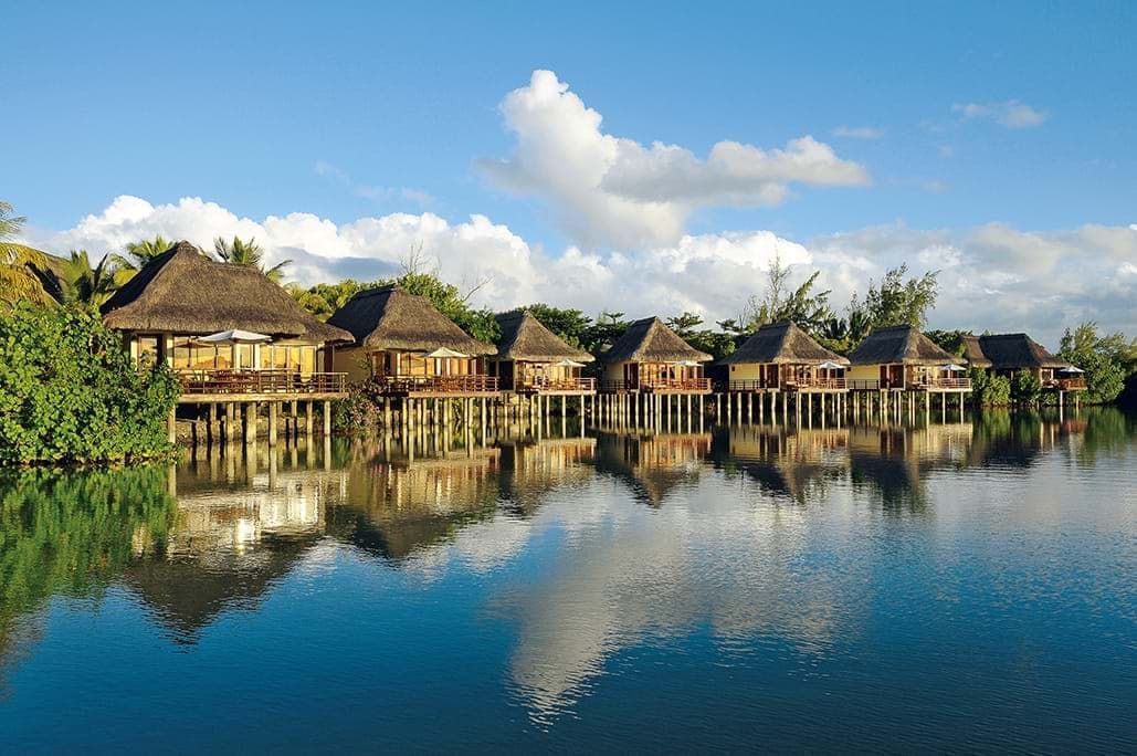 Overwater bungalows on seashore in Mauritius