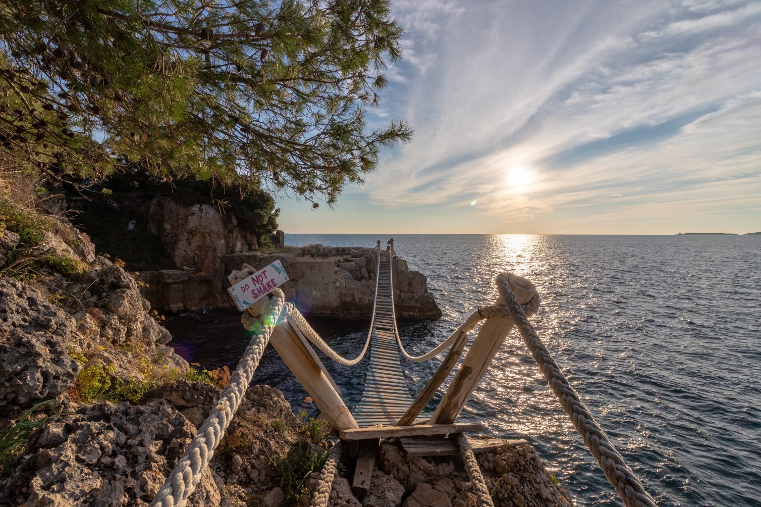 Small wooden bridge connecting two islands in Pula Croatia